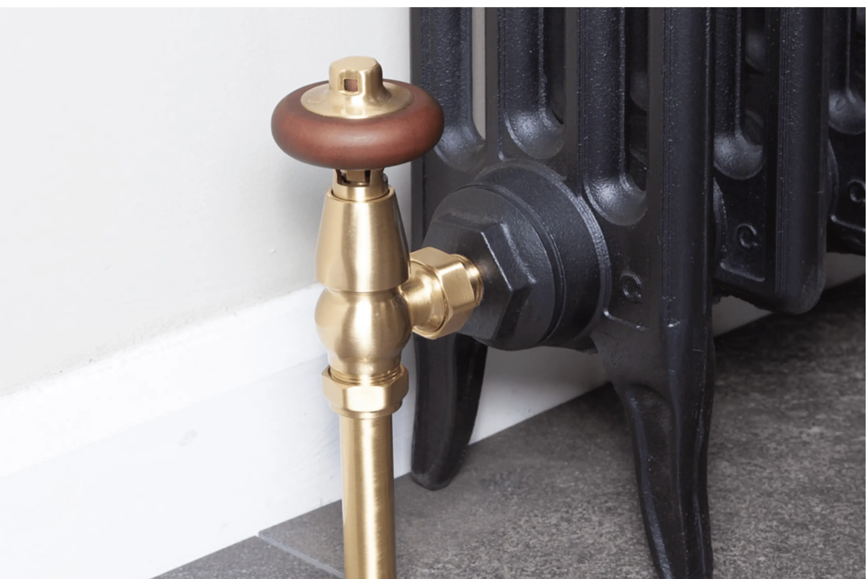 Stunning Black Radiator Matched With Brushed Brass Valves